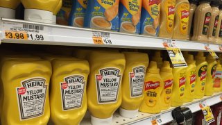 Bottles of H.J. Heinz Co. yellow mustard are displayed for sale at a supermarket in Closter, New Jersey