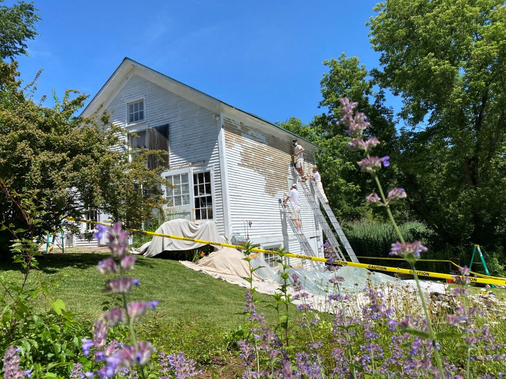 A historic barn being repainted by Painting With Purpose in Vermont on Wednesday, June 29, 2022.