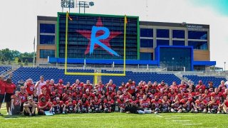 The Boston Renegades women's football team celebrates their first consecutive national championship.