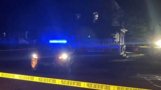 Blue police lights and crime scene tape in Burlington, Vermont