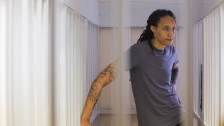 US’ Women’s National Basketball Association (NBA) basketball player Brittney Griner, who was detained at Moscow’s Sheremetyevo airport and later charged with illegal possession of cannabis, waits for the verdict inside a defendants’ cage before a court hearing in Khimki outside Moscow, on August 4, 2022. 