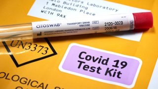 FILE - In this photo illustration, a Citoswab Coronavirus (COVID-19) Home Test Kit