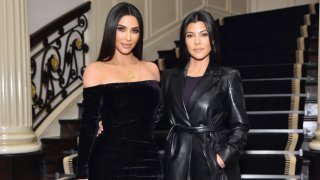 FILE - Kim Kardashian and Kourtney Kardashian