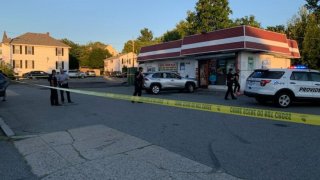 Police responded Wednesday to a shooting at Tom's Food Mart on Chalkstone Avenue in Providence, Rhode Island.