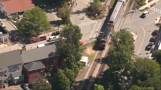 An MBTA commuter train stopped in Concord, Massachusetts, after a vehicle was struck on the tracks Wednesday, Aug. 31, 2022.
