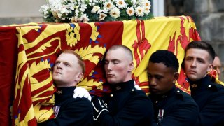 Pallbearers carry the coffin of Queen Elizabeth II