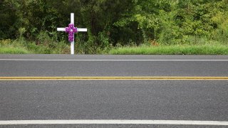 A roadside memorial marks the scene where a loved one has been killed in a car accident.
