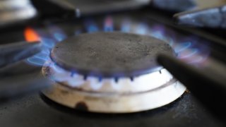 A gas hob burning on a stove.