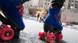 People roller skate at Flipper's Roller Boogie Palace NYC at Rockefeller Center on May 4, 2022