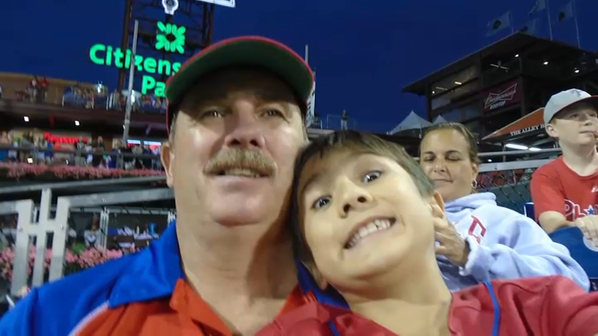 Cody Newton, 16, and his late father at a Phillies game.