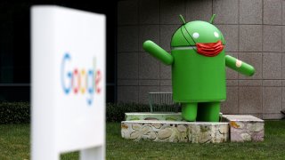 An Android statue is displayed in front of a building on the Google campus on January 31, 2022 in Mountain View, California. Google parent company Alphabet will report fourth quarter earnings on Tuesday after the closing bell.