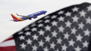 A Southwest Airlines passenger jet takes off at Chicago's Midway International Airport on Friday, July 1, 2022, in Chicago.