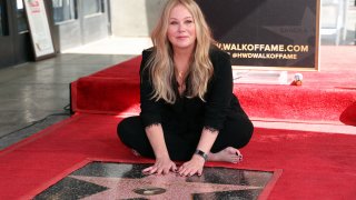 FILE - Christina Applegate poses with her star during her Hollywood Walk of Fame Ceremony