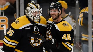 Nov 17, 2022; Boston, Massachusetts, USA; Boston Bruins center David Krejci (46) congratulates goaltender Linus Ullmark (35) after they defeated the Philadelphia Flyers at TD Garden. Mandatory Credit: Winslow Townson-USA TODAY Sports