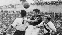 English midfielder Thomas Finney, center, tries to head the ball between U.S. defenders Charlie Colombo and Edward John McIlvenny during the World Cup first-round match between England and the United States, June 29, 1950. The United States routed heavy favorites England 1–0 on a goal scored by forward Joseph Gaetjens.