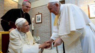 Pope Francis greets Pope Emeritus Benedict XVI