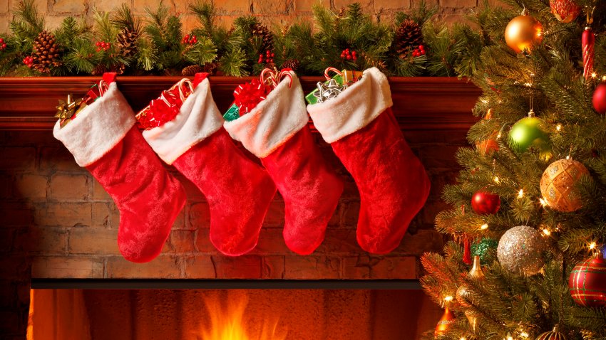 Christmas stockings hanging from a mantelpiece