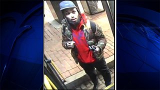 MBTA Transit Police said Friday night they were looking to identify and question a man in connection with a shooting that left a woman injured on a bus near Andrew Square.
