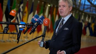 Finland's Foreign Minister Pekka Haavisto speaks with the media as he arrives a meeting of EU foreign ministers at the European Council