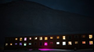 Windows light up the polar night in Longyearbyen, Norway