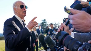 President Joe Biden talks with reporters on the South Lawn of the White House in Washington, Jan. 30, 2023, after returning from an event in Baltimore on infrastructure.