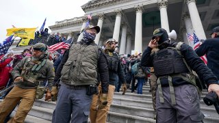 FILE - Members of the Oath Keepers extremist group stand on the East Front of the U.S. Capitol on Jan. 6, 2021, in Washington.