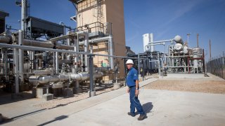 Deward Cawthon, plant operator at the Federal Helium Reserve, walks through the Federal Crude Helium Enrichment Unit near Amarillo, Texas,