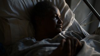 Woman who is bedridden due to a stroke.