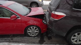 Two parked vehicles damaged in a chain-reaction crash in Exeter, New Hampshire, on Saturday, Feb. 25, 2023, that police said was caused by a drunken driver.
