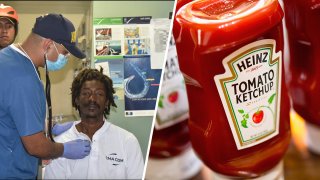 Castaway Elvis Francois being attended to by Colombian Navy members; Heinz ketchup