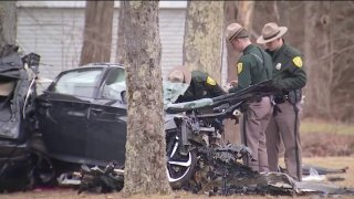 Police at the scene of a deadly car crash in East Kingston, New Hampshire, on Tuesday, March 28, 2023.
