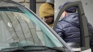 FILE – Wall Street Journal reporter Evan Gershkovich is escorted by officers from the Lefortovsky court to a bus, in Moscow, Russia, Thursday, March 30, 2023.