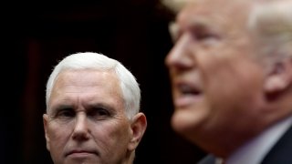 FILE - Then-Vice President Mike Pence and then-President Donald Trump listen during a conference call with the International Space Station on Oct. 18, 2019, in Washington, D.C.