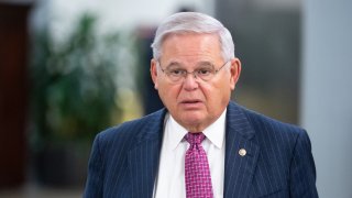 File-  Bob Menendez, D-N.J., walks through the Senate subway on his way to a vote in the Capitol