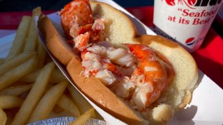 A lobster roll, fries and a drink at the Lobster Hut in Plymouth, Massachusetts.