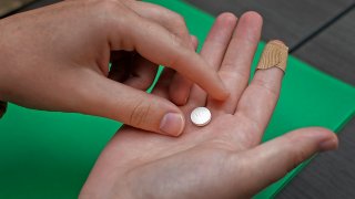 FILE – A patient prepares to take the first of two combination pills, mifepristone, for a medication abortion during a visit to a clinic in Kansas City, Kan., on Wednesday, Oct. 12, 2022. Wyoming’s first-in-the-nation ban on abortion pills will come before a state judge Thursday, June 22, 2023, as the court considers whether the prohibition should take effect as planned July 1 or be put on hold pending the outcome of a lawsuit. (AP Photo/Charlie Riedel, File)