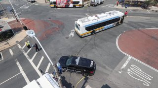 A downed power line across several vehicles near city hall in Chelsea, Massachusetts, on Friday, June 16, 2023.