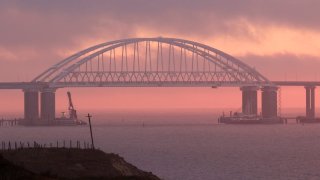 A general view shows a road-and-rail bridge, which is constructed to connect the Russian mainland with the Crimean peninsula, at sunrise in the Kerch Strait, Crimea November 26, 2018.