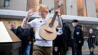 Ed Sheeran with an acoustic guitar in New York City