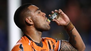 Joe Ofahengaue of the Tigers drinks pickle juice during the round 17 NRL match between the Wests Tigers and the Parramatta Eels at Leichhardt Oval on July 09, 2022 in Sydney, Australia.