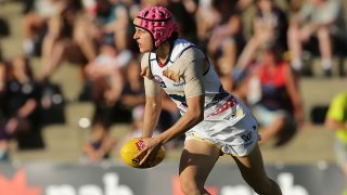 Heather Anderson of the Crows looks to pass the ball during the round four AFL Women’s match between the Fremantle Dockers and the Adelaide Crows at Fremantle Oval on February 26, 2017 in Fremantle, Australia.