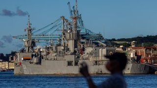 A man takes picture at the harbour where Taiwanese Navy warships are anchored on August 07, 2022 in Keelung, Taiwan.