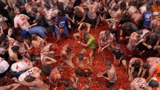 Revellers throw tomatoes at each other during the annual “Tomatina” tomato fight fiesta, in the village of Bunol near Valencia, Spain, Wednesday, Aug. 30, 2023.