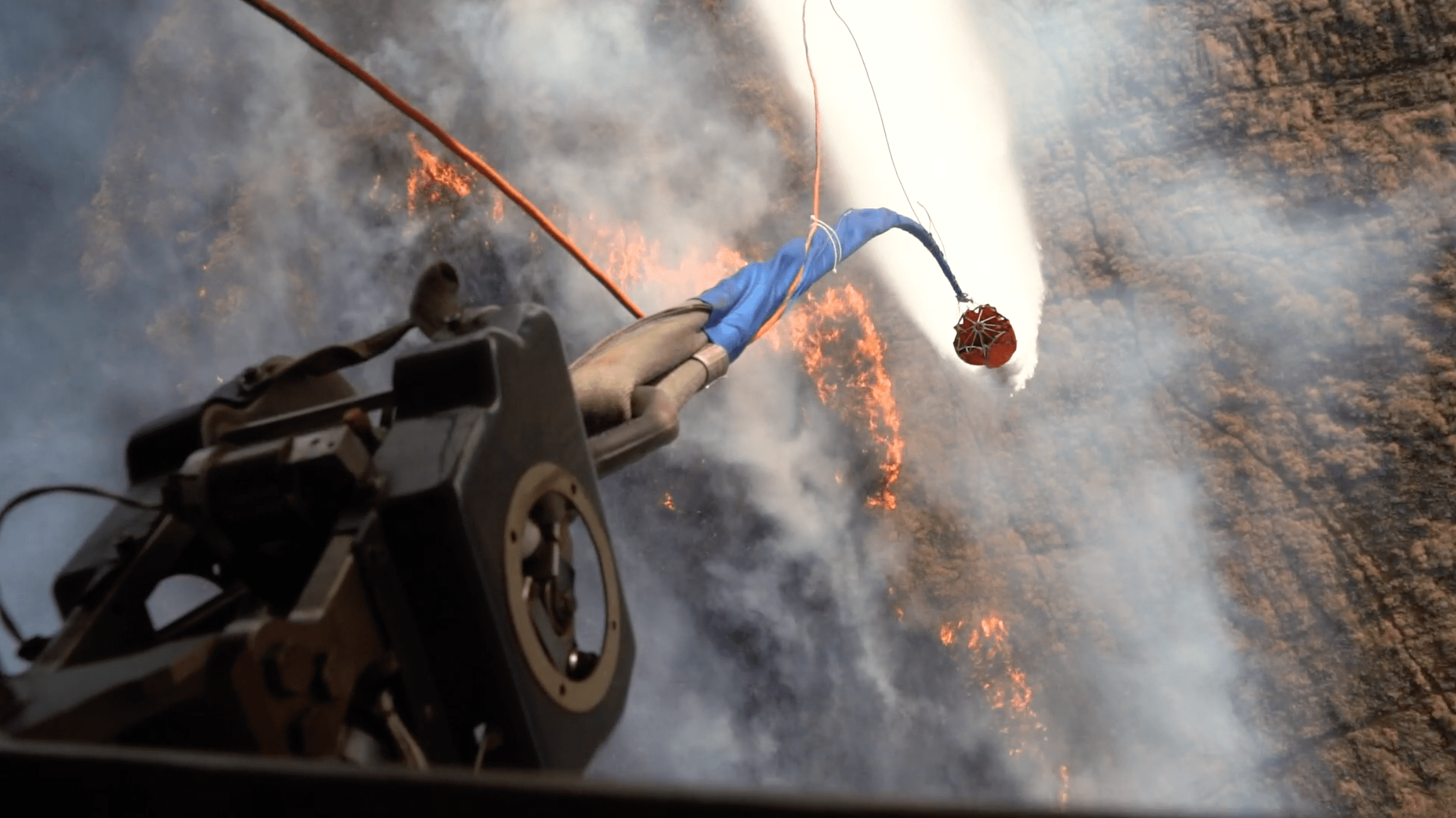 Hawaii Army National Guard helicopters fight wildfires with bucket drops, Aug. 9, 2023, in Maui, Hawaii. The National Guard said they dropped more than 100,000 gallons of water on the fires.