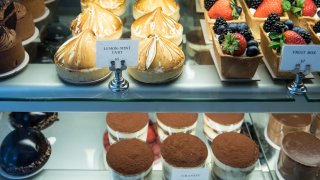 This file photo shows tarts, cakes and pastries at a Tatte Bakery and Cafe in Boston.