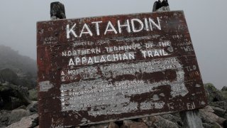 Staff Photo by Shawn Patrick Ouellette: A weathered sign at Baxter Peak marks the elevation of Katahdin at 5267 ft. The Knife Edge is a 1.1 mile stretch from Pamola Peak to Baxter Peak. (Photo by Shawn Patrick Ouellette/Portland Press Herald via Getty Images)