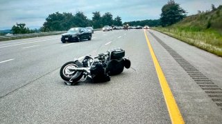 A crashed motorcycle on the F.E. Everett Turnpike in Nashua, New Hampshire, on Tuesday, Aug. 29, 2023.