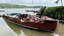 A damaged boat involved in a hit-and-run crash on Lake Winnipesaukee Saturday, Aug. 12, 2023.