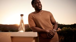 Kevin Hart with a bottle of his Gran Coramino tequila.