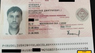 FILE - This image provided by the U.S. Attorney's Office, shows a Russian passport of Vladislav Klyushin, part of the government evidence